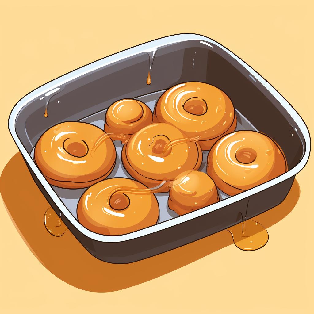 Golden brown donuts in a donut pan fresh out of the oven.